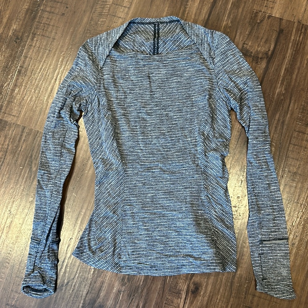 Lululemon long sleeve, size 6, zipper pocket in back, thumb holes